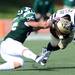 Eastern Michigan sophomore Colin Weingrad attempts to tackle Western Michigan sophomore Brian Fields during the first half against Western Michigan at Rynearson Stadium on Saturday afternoon. Melanie Maxwell I AnnArbor.com